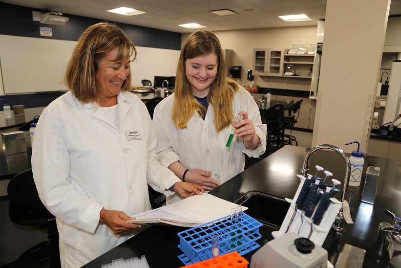 Lab Science Instructor Julie Maurina-Brunker (left) and recent graduate Heather Beil Lab Science Instructor Julie Maurina-Brunker (left) and recent graduate Heather Beil
